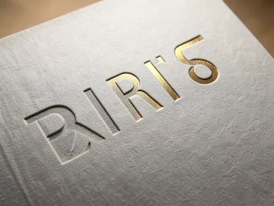 Debossed impression in thick card stock, pressed-in letter forms creating shadow