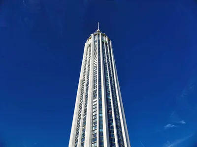 Cumulus tower against deep blue sky