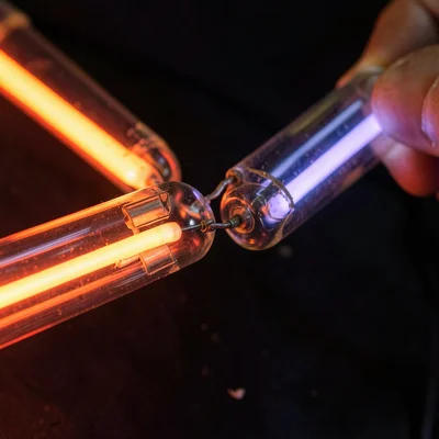 A repair in progress: a replacement section of tube being soldered into an exist