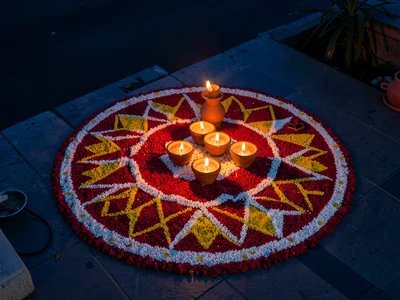 Floral Rangoli Surrounding Diya Cluster