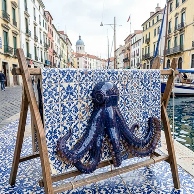 Azulejo tile geometry, Portuguese ceramic culture, Octopus drying on wooden rack