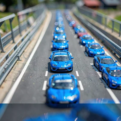 Elevated tilt-shift photograph from a marshal post of a circuit straight, satura