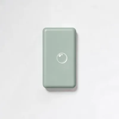 Flat-color vertical of a soap bar silhouette with a small bubble, sage and butte