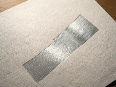 Silver embossed foil with linear brushed pattern, directional metallic texture l