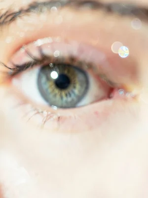 Eye close-up with catchlight, rest falling away