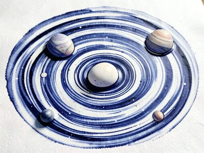Three eggs floating in the marbled ink water surface before pressing, their shap