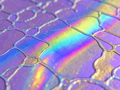 Silicon wafer surface at macro scale, oxide thickness variations creating a map 
