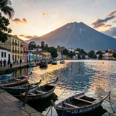 Colonial color against volcano in Granada, Nicaragua, Wooden boats moored at Lak