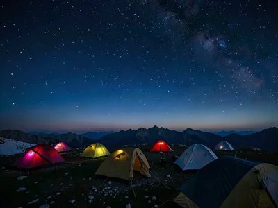 High camp tents under sky transitioning from evening blue to cosmic black