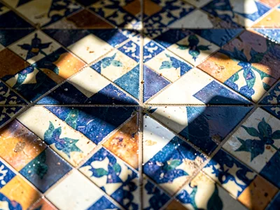 Shadow of window falling across tile pattern