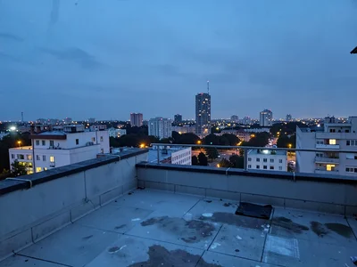 Rooftop at blue hour city beyond