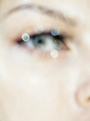 Eye close-up with catchlight, rest falling away