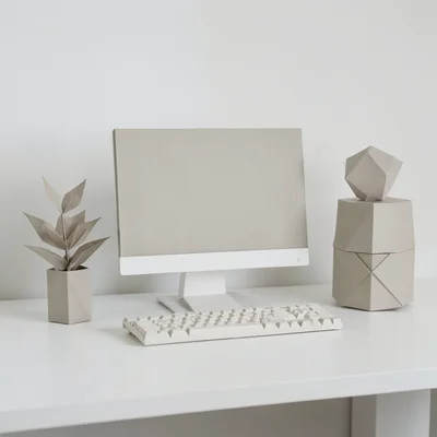 Minimalist home office where every object is made of origami — monitor, keyboard