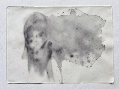 Ink plate after printing, residual thin film showing ghost of what was pulled, p