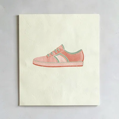 Riso campaign motif of a halftone shoebox-with-shoe motif in coral and sage over
