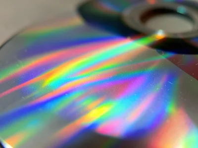 CD surface extreme macro, rainbow diffraction grating creating spectral bands ac