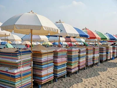 Beach umbrellas stacked in tight rows