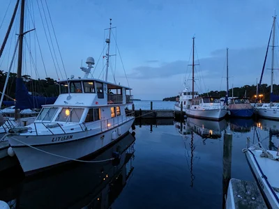 Harbor boats with cabin lights in blue hour