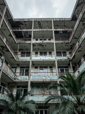 Looking Up from Courtyard at Brutalist Balcony Grid Tower