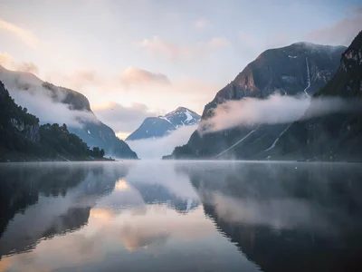 Evening mist rising from water surface
