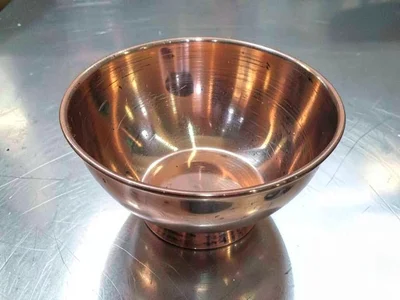 Copper spun bowl showing techniques