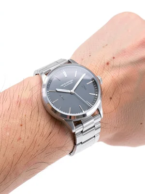Watch on wrist, white backdrop
