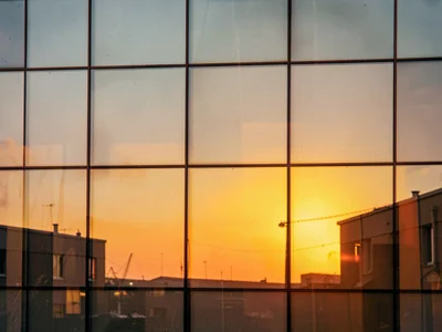 Glass catching last light as warm amber