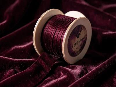 Velvet ribbon spooling, craft store luxury, DIY elegance