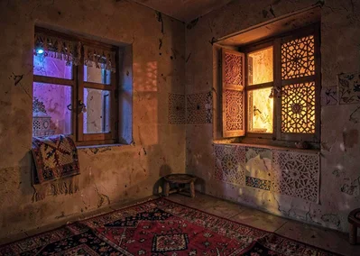 Colored light through qamariya windows in Sana'a, Yemen, interior with tradition