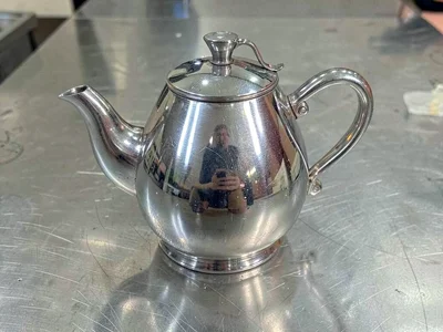 Silver coffee pot belly curve