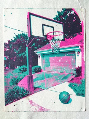 Basketball hoop at the end of a driveway tilted slightly with the net in tatters