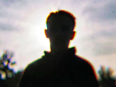 Backlit figure creating color blur