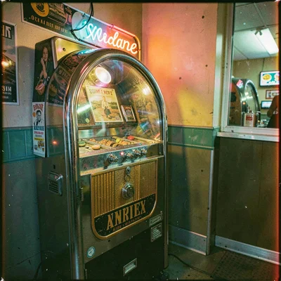 Cross-processed slide film photograph, Vintage jukebox in diner corner, chrome r