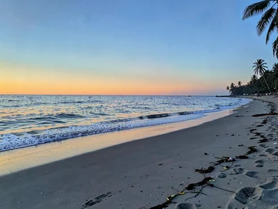 Beach with sunset glow fading to blue