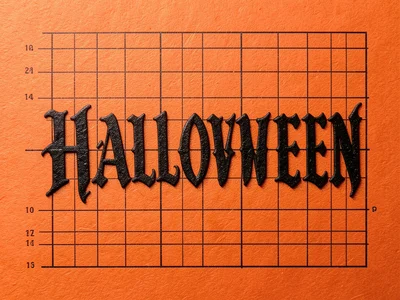 Letterpress HALLOWEEN in gothic type, deep impression in black ink on orange pap