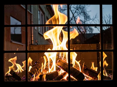Fire reflection in window glass overlay