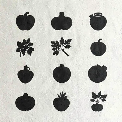 Modular grid of twelve ingredient silhouettes on cream card, faint paper grain