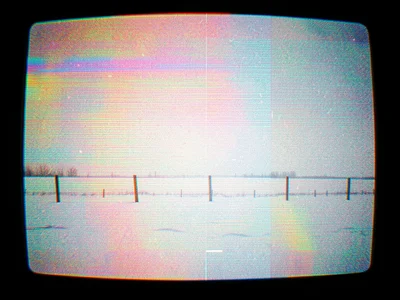 Blizzard whiteout conditions, barely visible fence posts in horizontal snow