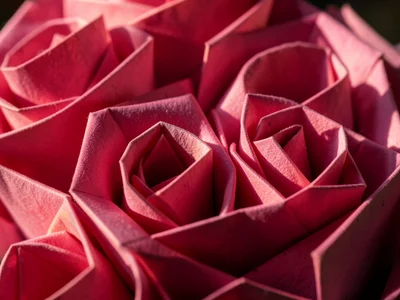 Origami roses in graduating pink shades, bouquet arrangement, macro detail