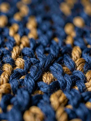 Single-thread macro of indigo-deep cotton warp at one centimeter shows fiber twi