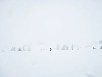 Single figure tiny in vast white