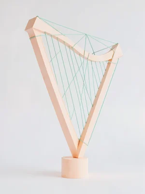 Strung peach lowpoly harp with mint strings stretched across a triangulated fram