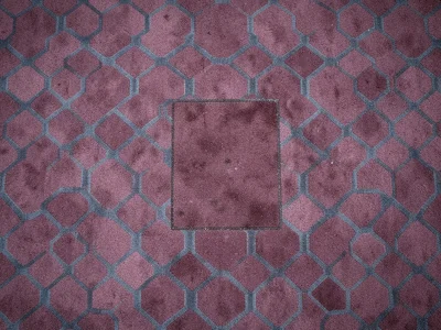 A 1980s airport hotel carpet, conservative geometric pattern of interlocking oct