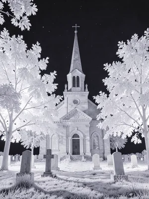 A country church surrounded by glowing white cemetery trees, stone pale and lumi
