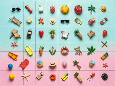 Dense flat-lay of thirty miniature summer leisure objects perfectly aligned on a