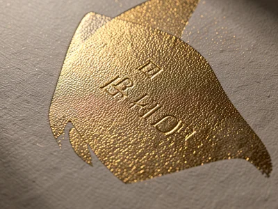 Gold foil sheet with fine hammered texture, thousands of tiny facets catching li