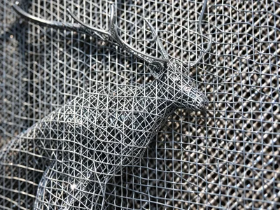 Wire mesh reindeer sculpture, fine gauge, holiday display, shadow play