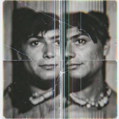 Damaged lenticular print with scratched lens surface, image partially revealed a