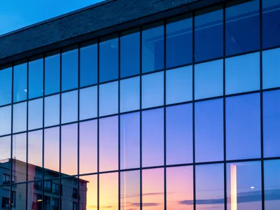 Blue hour building glowing with sky color
