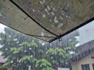 Rain drumming on canvas awning